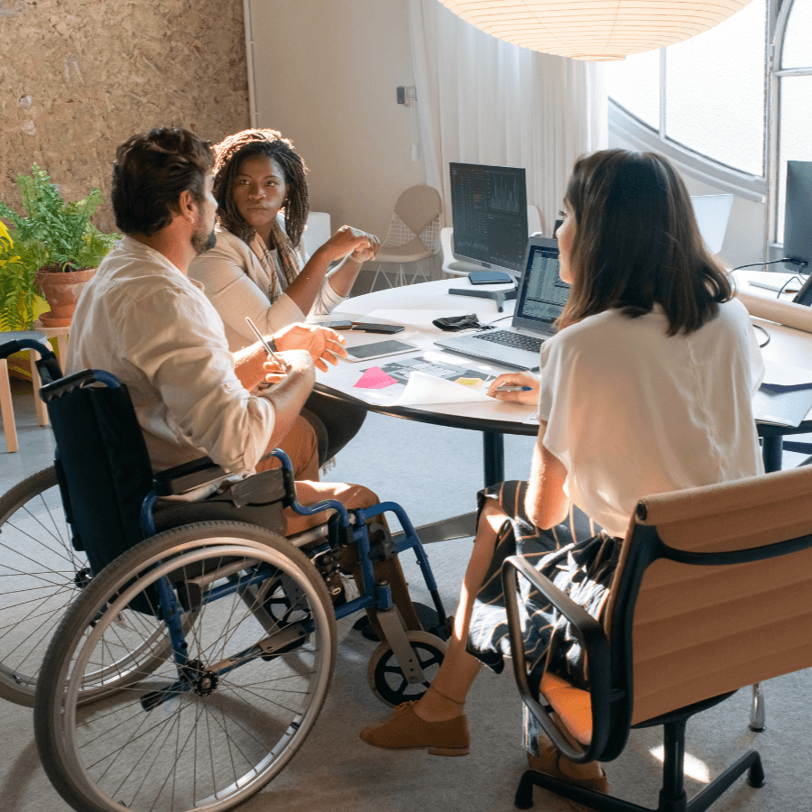 A Person helping a disabled individual